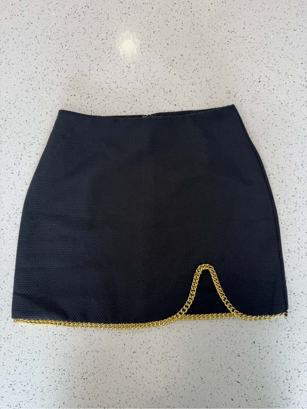 Line & Dot Black Mini Skirt with Gold Chain Accent